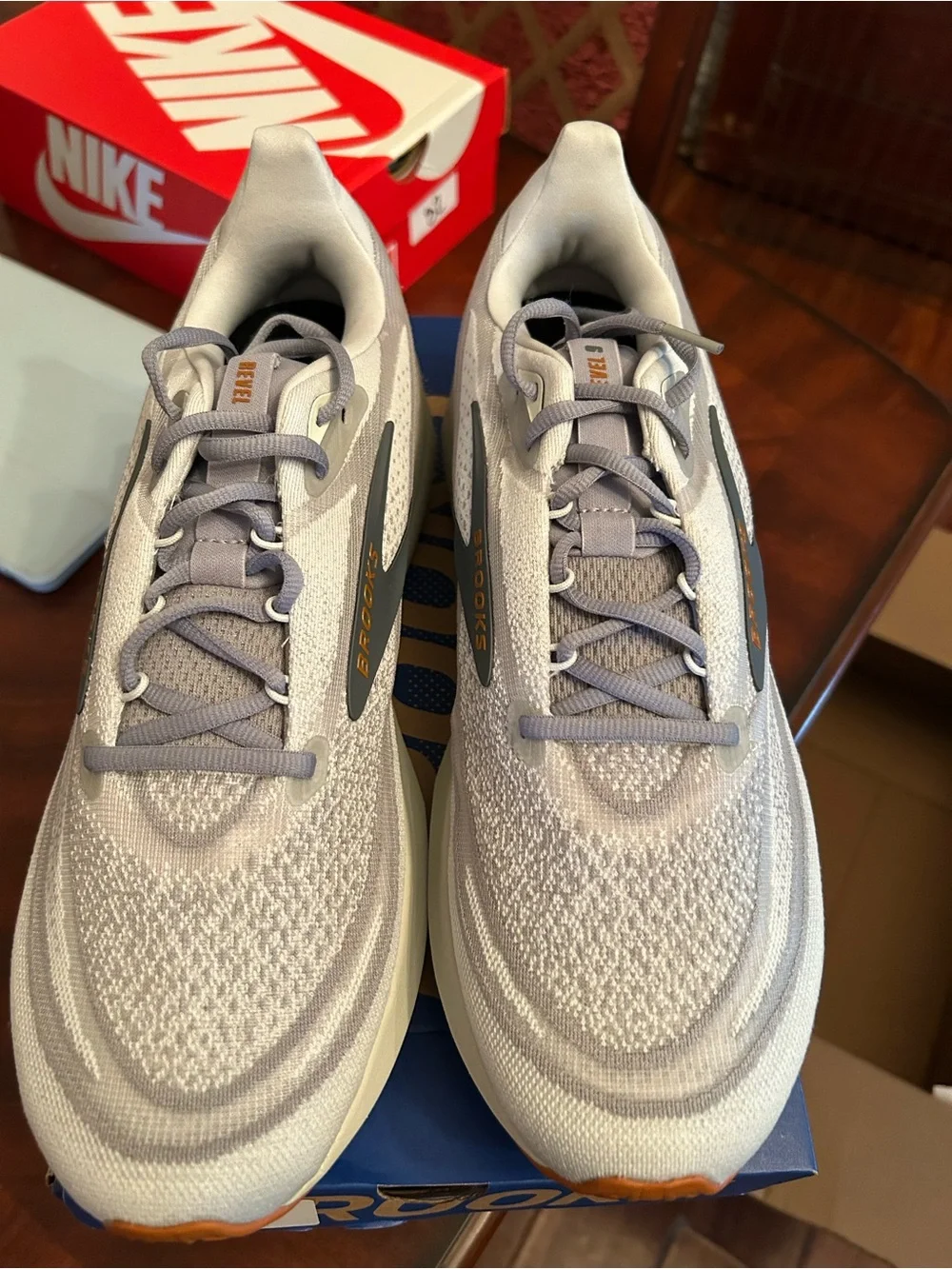 Men’s Brooks light gray and blue knit running shoes with gum outsole